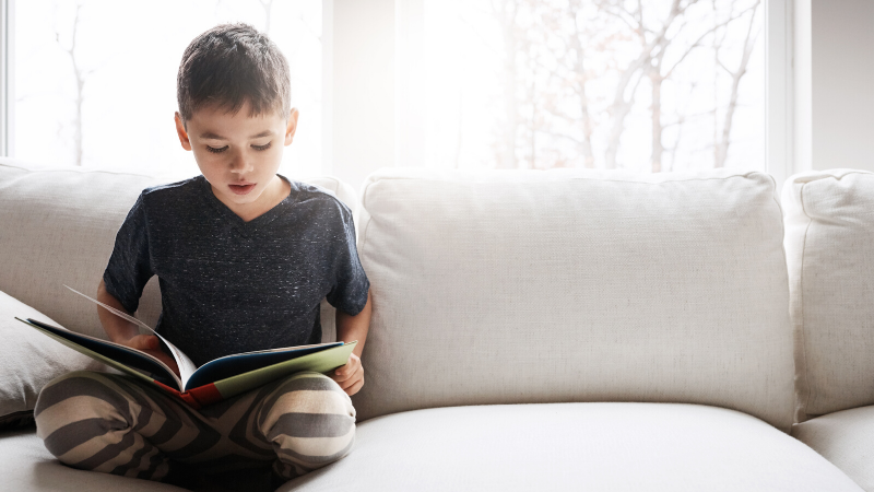 boy reading on the sofa boy reading on the sofa