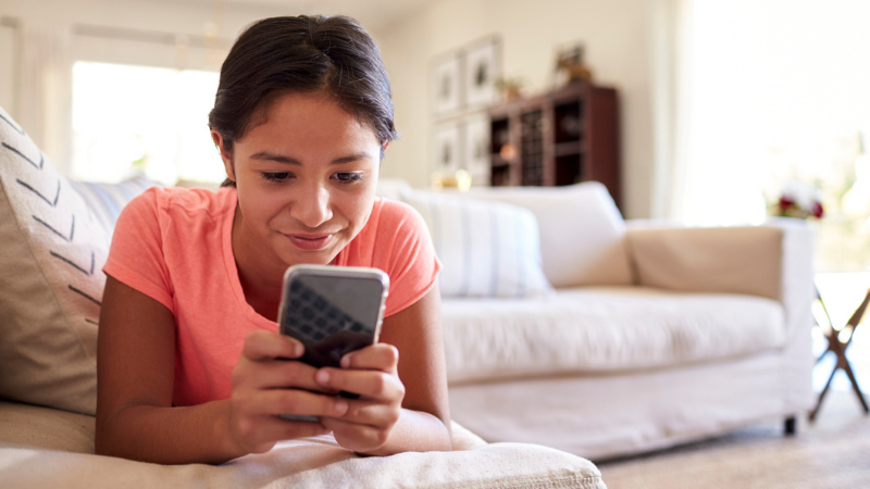 teenage girl on her phone at home teenage girl on her phone at home