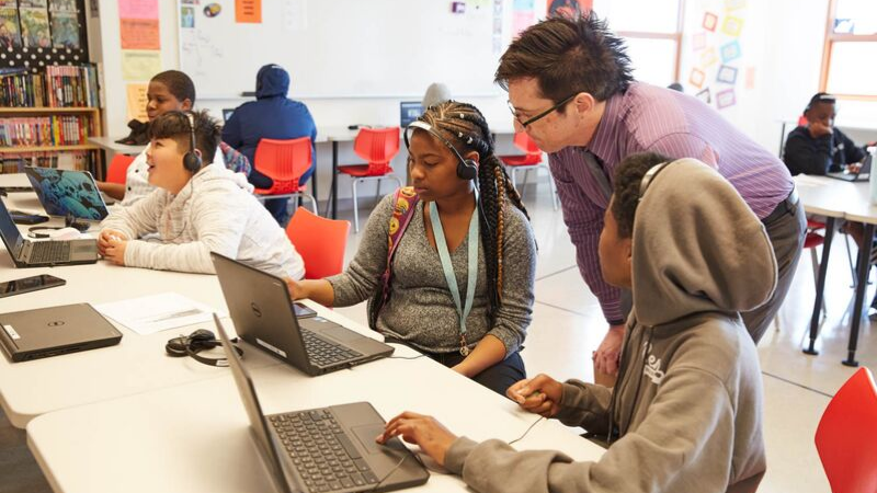 substitute teacher working with students substitute teacher working with students