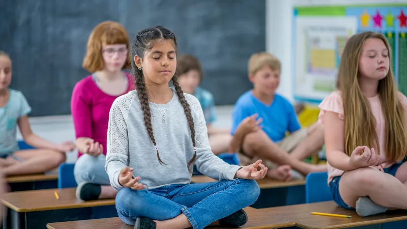 students meditating