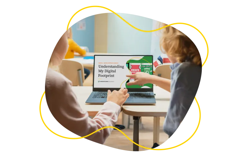 Photo of a teacher and a student learning about digital literacy