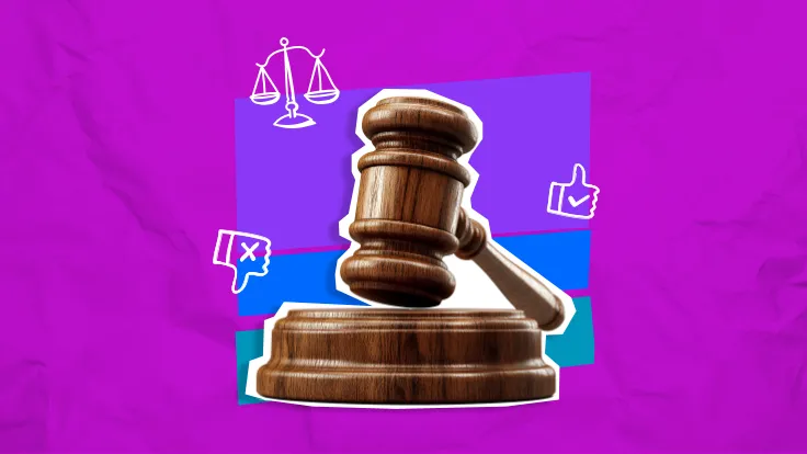 A judge's gavel, resting on it's stand