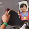 kid's face on a phone screen with skateboard in the background