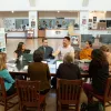 Photo of teachers meeting in a library